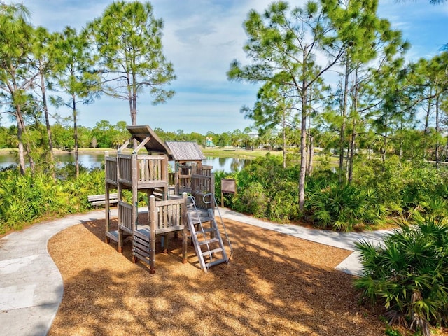 view of jungle gym featuring a water view