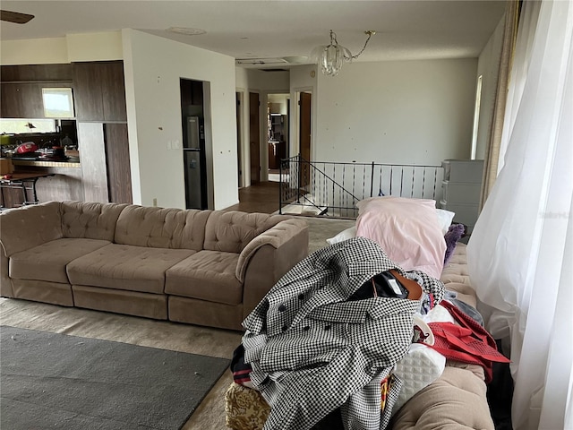 living room with a notable chandelier