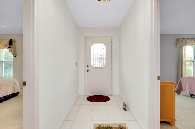 entrance foyer with light carpet