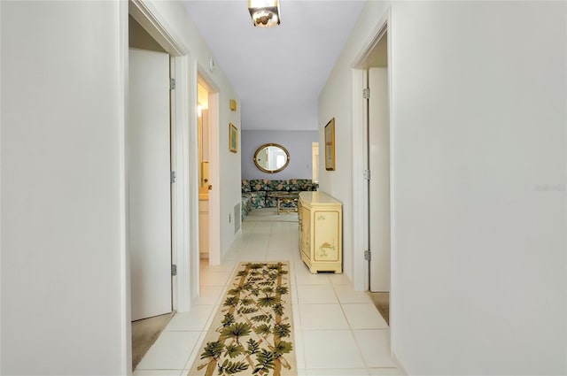 corridor featuring light tile patterned floors