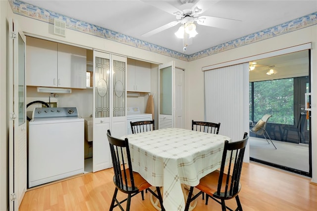 dining room with ceiling fan, washer / dryer, and light hardwood / wood-style flooring