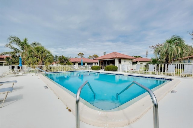 view of swimming pool featuring a patio