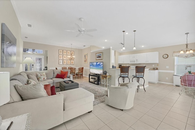 living room featuring ceiling fan with notable chandelier and light tile patterned flooring