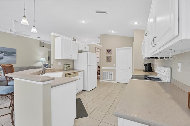 kitchen with white appliances, white cabinets, hanging light fixtures, kitchen peninsula, and light tile patterned floors