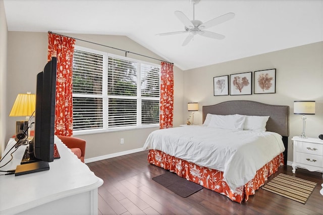 bedroom featuring ceiling fan, dark hardwood / wood-style floors, and lofted ceiling