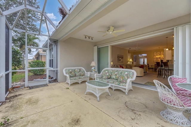 sunroom / solarium with ceiling fan