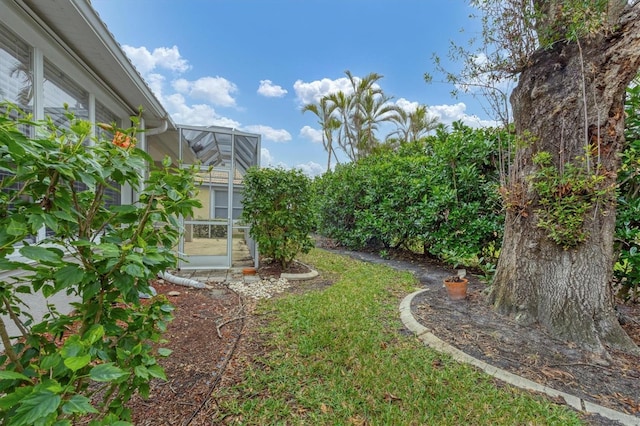 view of yard with a lanai