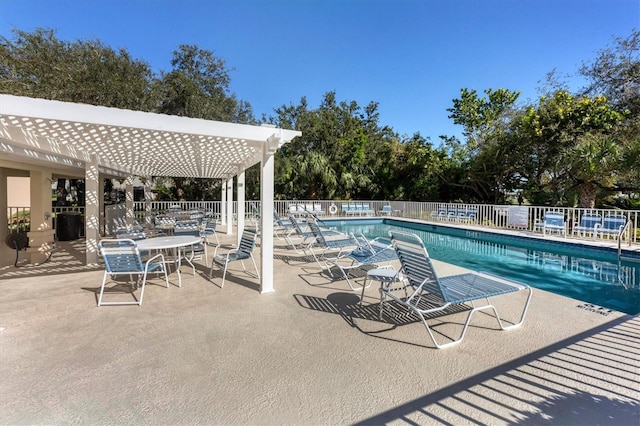 view of pool with a patio and a pergola