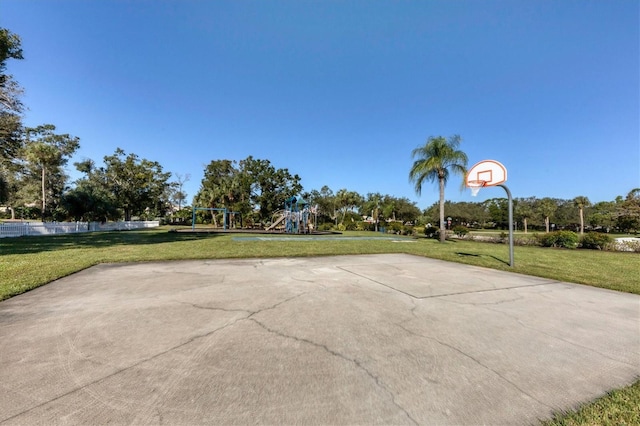 view of patio / terrace featuring a playground and basketball hoop