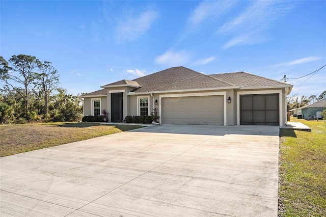 view of front facade with a garage and a front lawn