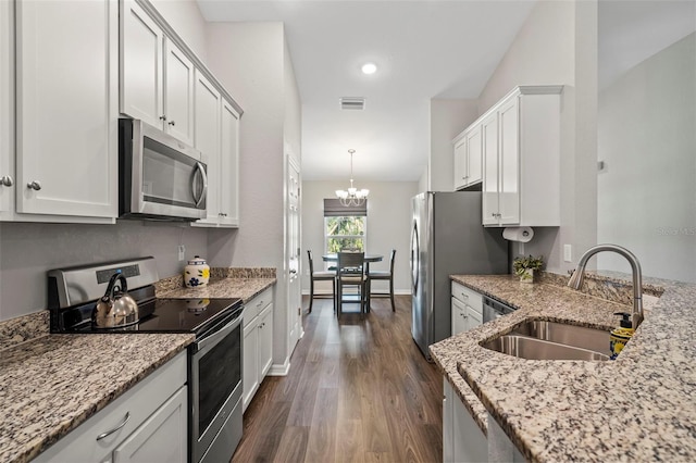 2949 Jaylene Rd, North Port, FL 34288 - kitchen featuring visible vents, a sink, dark wood finished floors, a notable chandelier, and stainless steel appliances