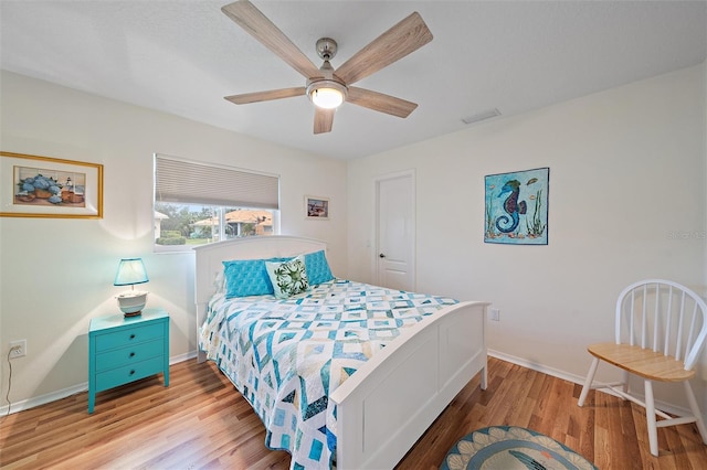 bedroom featuring hardwood / wood-style floors and ceiling fan