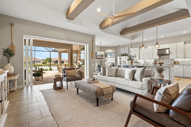 living room with beamed ceiling and ceiling fan