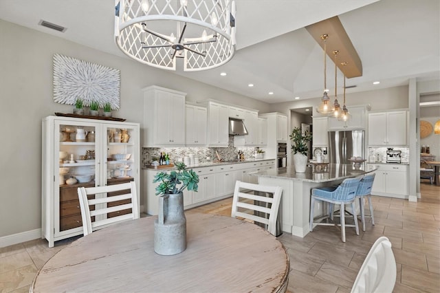 dining space featuring a notable chandelier