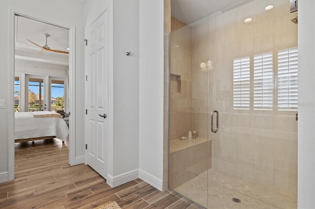 bathroom with ceiling fan and walk in shower