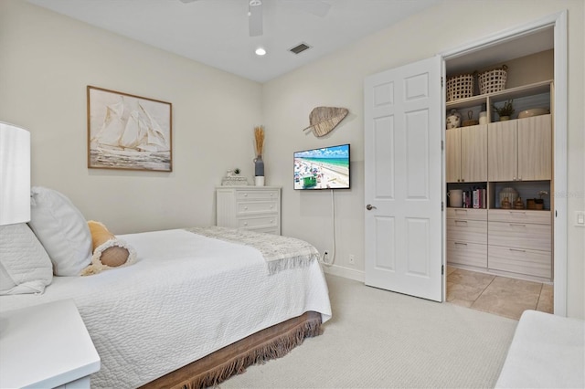 bedroom featuring light tile patterned flooring and ceiling fan