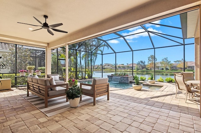 view of patio / terrace featuring a water view, pool water feature, outdoor lounge area, and glass enclosure