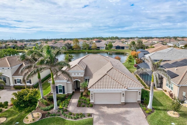 birds eye view of property with a water view