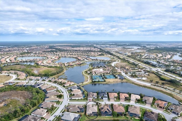 bird's eye view with a water view