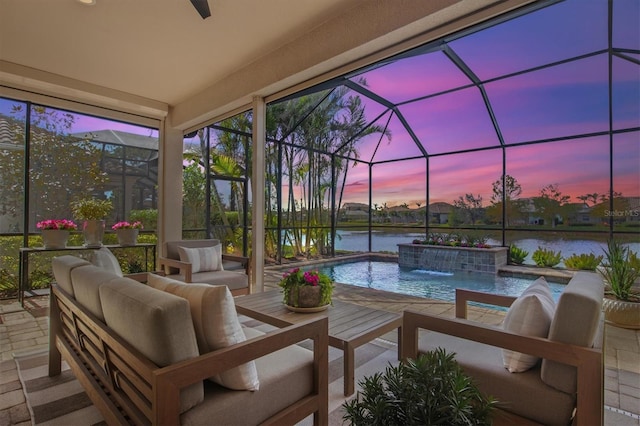 exterior space featuring pool water feature, a patio area, a water view, a lanai, and an outdoor hangout area