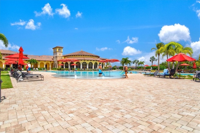 view of pool featuring a patio and pool water feature