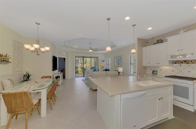 kitchen with sink, white cabinetry, white appliances, and extractor fan