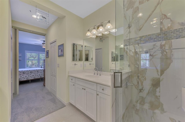 bathroom featuring vanity, ceiling fan, and walk in shower