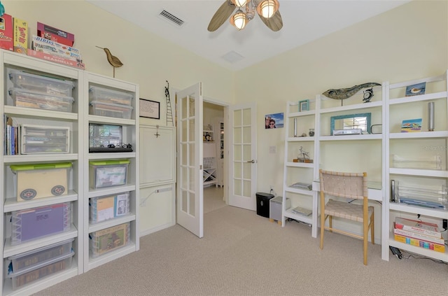 carpeted office featuring ceiling fan and french doors