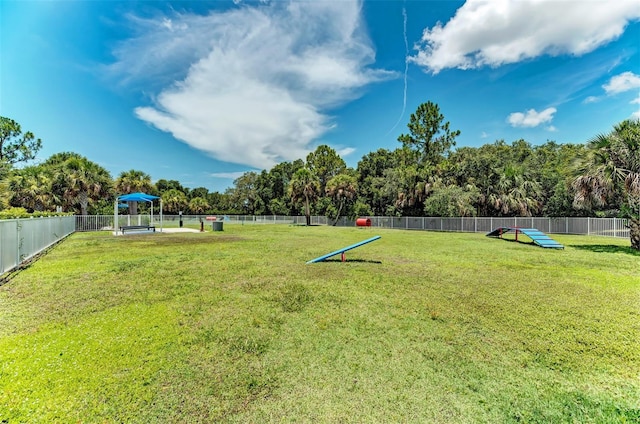 view of home's community with a yard