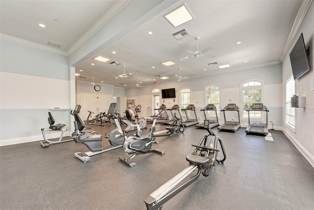 exercise room featuring ceiling fan and ornamental molding