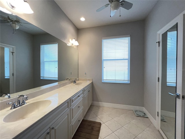 bathroom featuring ceiling fan, tile patterned floors, and vanity