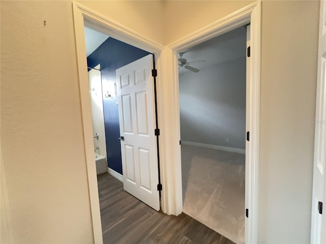 corridor with dark wood-type flooring