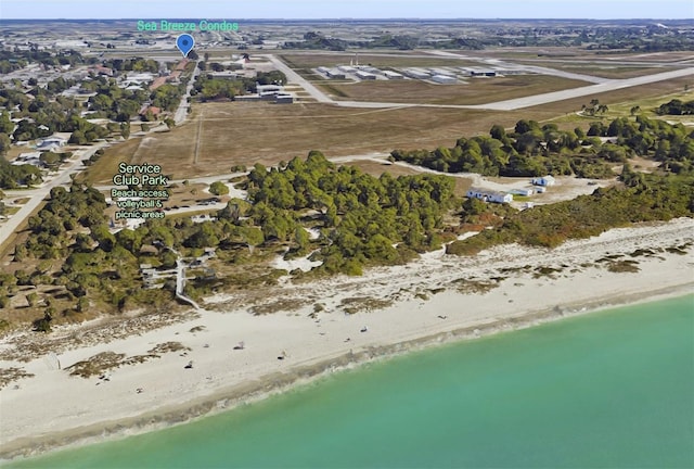 aerial view featuring a water view and a beach view