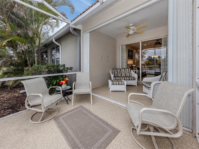 exterior space with outdoor lounge area and ceiling fan