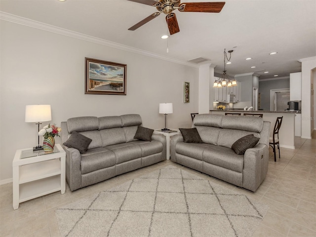 tiled living room featuring ornamental molding and ceiling fan with notable chandelier