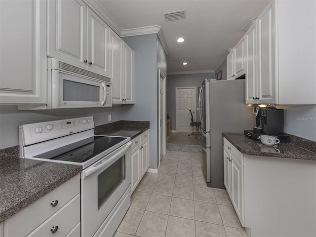 kitchen featuring crown molding, white appliances, light tile patterned floors, and white cabinets