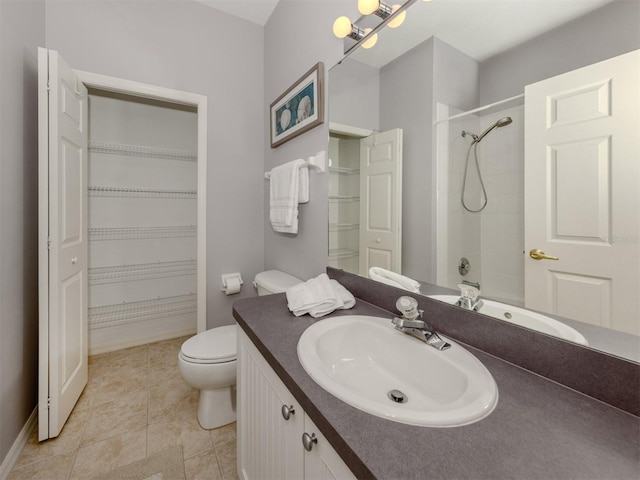 full bathroom with tile patterned flooring, vanity, shower / tub combination, and toilet