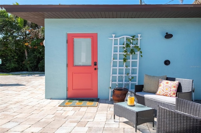 doorway to property featuring a patio area