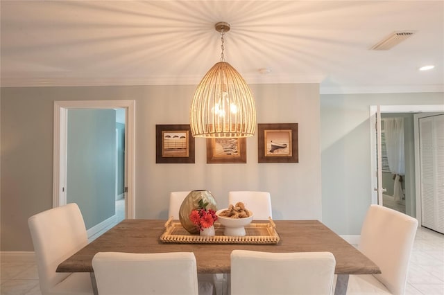 tiled dining area with crown molding and a notable chandelier