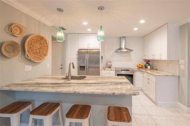 kitchen featuring white cabinetry, sink, stainless steel appliances, light stone countertops, and wall chimney exhaust hood