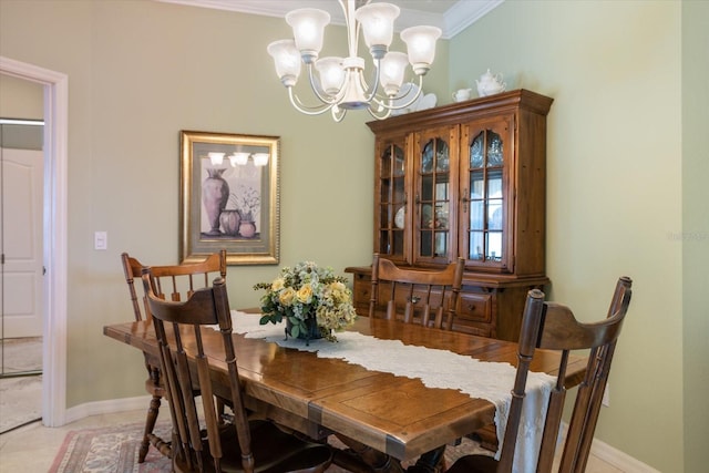 tiled dining room featuring crown molding and an inviting chandelier