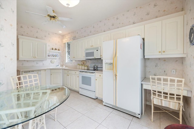 kitchen with white cabinetry, white appliances, sink, and light tile patterned floors