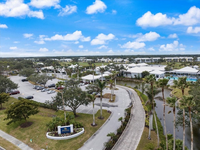 birds eye view of property with a residential view