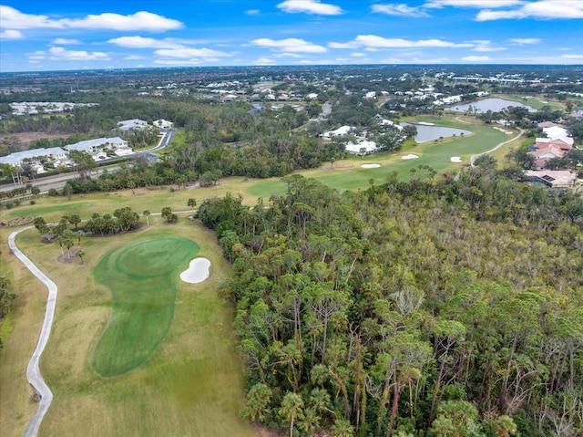 drone / aerial view featuring view of golf course and a water view