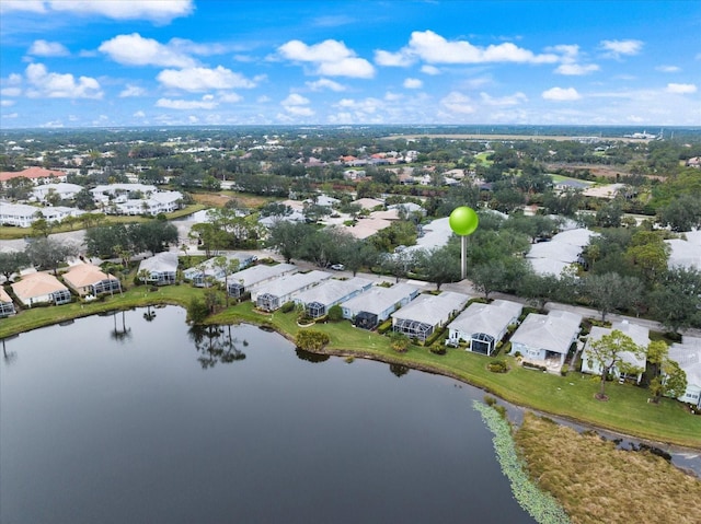 drone / aerial view featuring a residential view and a water view