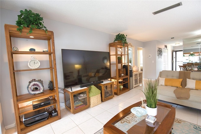 tiled living room with a textured ceiling