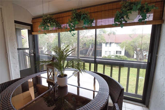 sunroom / solarium with vaulted ceiling