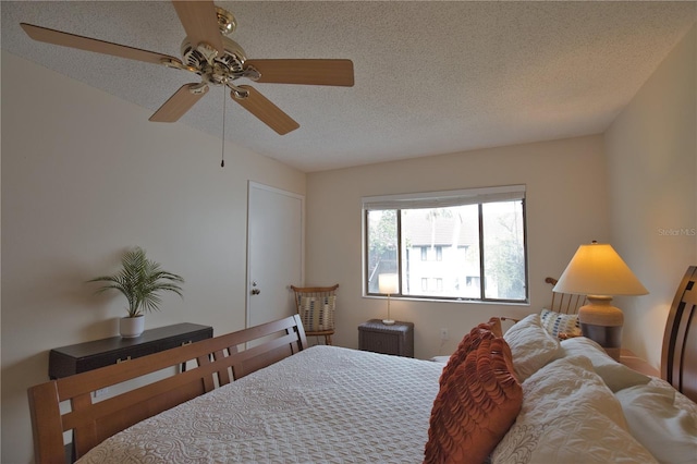 bedroom featuring a textured ceiling and ceiling fan