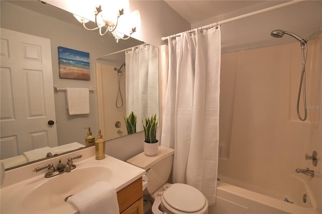 full bathroom featuring a notable chandelier, vanity, shower / tub combo with curtain, and toilet