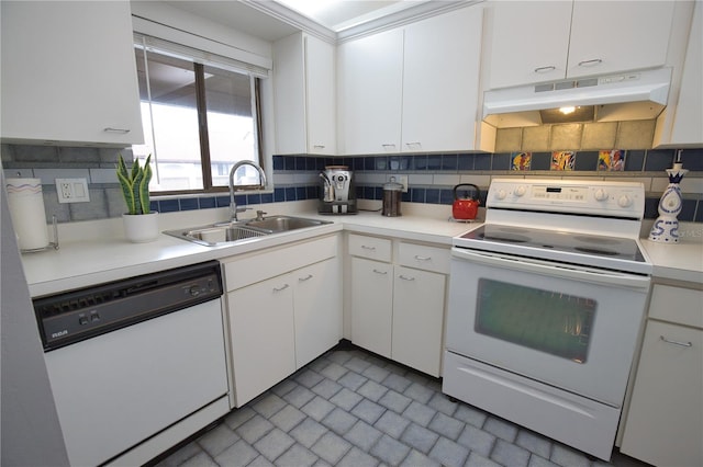 kitchen featuring white cabinetry, sink, white appliances, and decorative backsplash